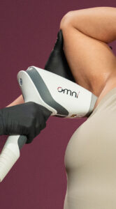 Sciton OMNI hair removal system handpiece removing hair from a woman's armpit